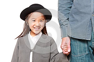 Japanese kindergartener walking to kindergarten wi