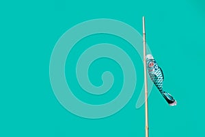 Japanese koi carp flag decoration blow in wind.koinobori japanese fish kite on green background