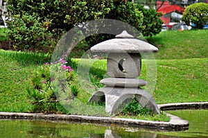 A japanese lantern on the lakeside in sunny day photo