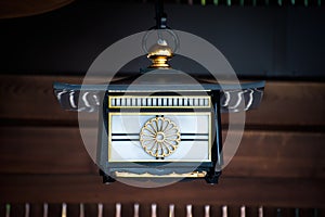 Japanese lantern showing the Chrysanthemum design of the Imperial Seal of Japan at the Meiji Shrine, Tokyo