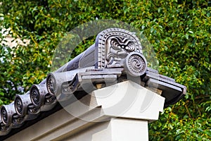 Japanese Lion pattern ceramic roof tile settled on the roof of sensoji temple, Tokyo Japan.