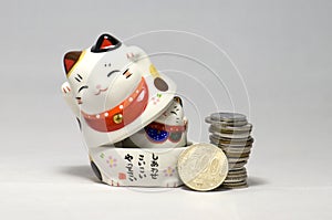Japanese Lucky Cats and yen photo
