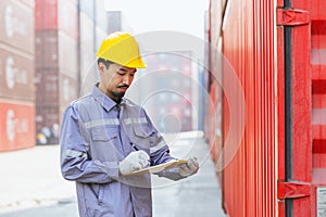 Japanese male smart worker working in container port cargo. Japan shipping logistics industry customs staff