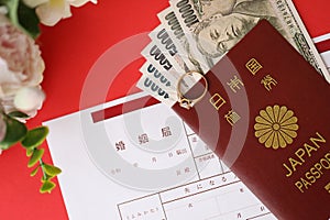 Japanese marriage registration blank document and wedding proposition ring and yen money on table