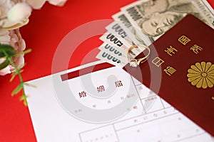 Japanese marriage registration blank document and wedding proposition ring and yen money on table