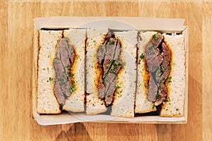 Japanese medium rare Wagyu sandwich served in wooden box