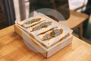 Japanese medium rare Wagyu sandwich served in wooden box