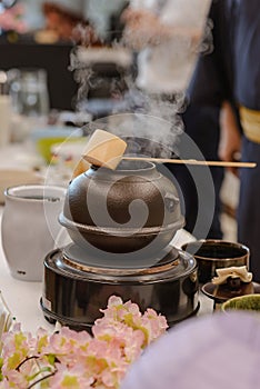 Japanese men preparing green tea during a demonstration.  Japanese tea ceremony