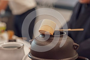 Japanese men preparing green tea during a demonstration.  Japanese tea ceremony