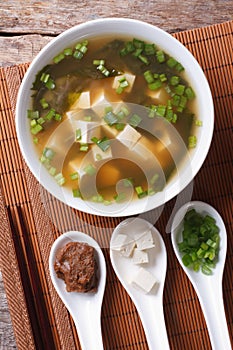 Japanese miso soup and ingredients. top view vertical photo