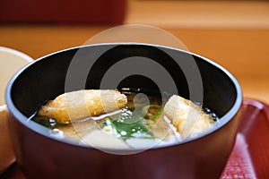 Japanese miso soup with kitsune tofu and wakame seaweed.