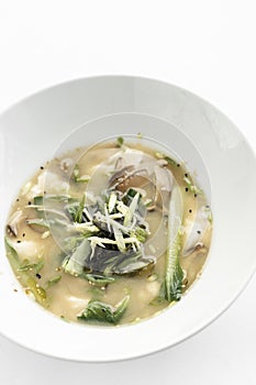 Japanese miso soup with tofu, shiitake mushrooms, bok choy and seaweed