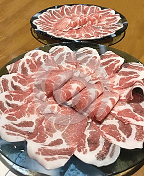 Japanese nabemono hotpot dish of thinly sliced meat boiled in water served with dipping sauces, also known as Shabu-shabu. The foo