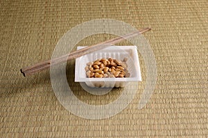 Japanese natto soybean in a styrofoam container with chopsticks