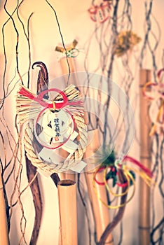 Japanese new year ornaments shimenawa wreath on bamboos