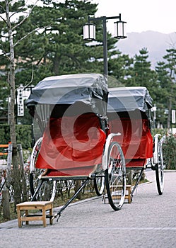 Japanese old and traditional tourist red and black rickshaw