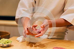 Japanese Omakase making Chutoro Sushi Medium Fatty Bluefin Tuna neatly by hands. Japanese traditional and luxury meal