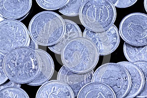 Japanese one yen coins on a black background