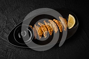 Japanese Pan-fried gyoza or dumplings snack on black background