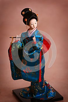 Japanese porcelain doll in blue kimono