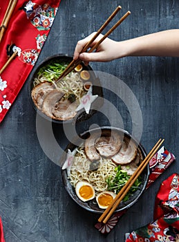 Japanese ramen soup with pork, egg and chives