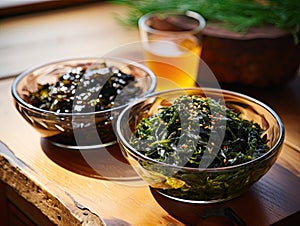 Japanese raw vegan organic delicious and tasty marinated chuka wakame salad and seaweed nori salad dishes in glass bowls