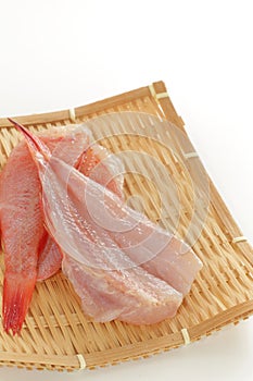 Japanese red fish, kinki fillet on bamboo basket photo