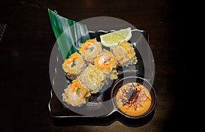 In the Japanese restaurant rolls with prawns tempura, banana lea