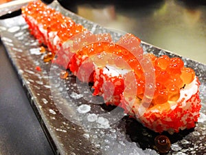 Japanese rice roll with Salmon roe on top and seaweed inside, la