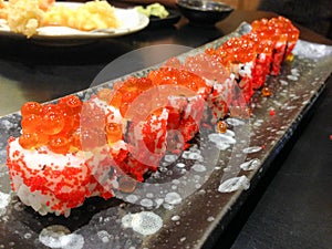 Japanese rice roll with Salmon roe on top and seaweed inside, la