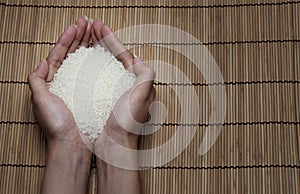 Japanese rice in your hand on Japanese mats