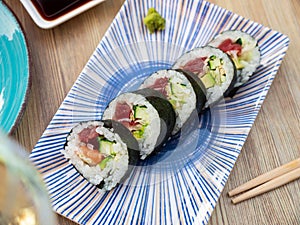 Japanese roll futomaki with soy sauces