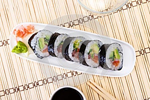 Japanese roll futomaki with soy sauces