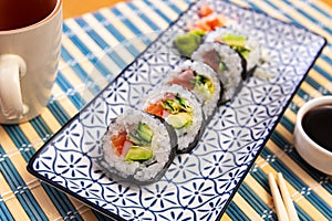 Japanese roll futomaki with soy sauces