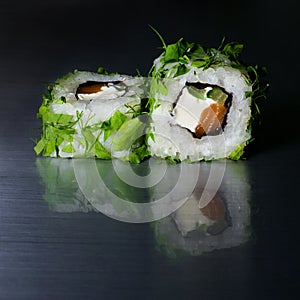 Japanese roll of rice, salmon, cucumber and cream cheese