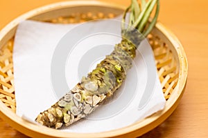 Japanese root of wasabi on basket