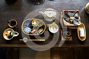 Japanese ryokan breakfast appetizer dishes including mentaiko, pickle, seaweed, bamboo shoot, hot plate, other side dishes