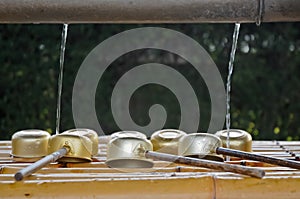 Japanese sacred ladles and holy water in local shrine in Kyoto