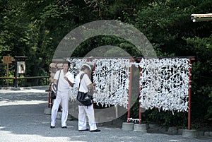 Japanese Sailors visiting Temple and making a wish in Kamakura, Japan
