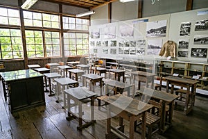 Historic class room with wooden deks and chairs. School class, Folklore Museum, Ogi, Japan.