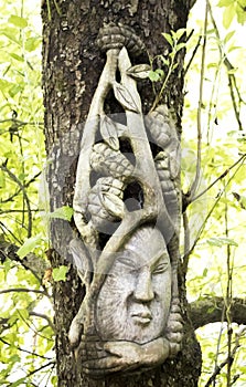 Japanese sculpture on a tree