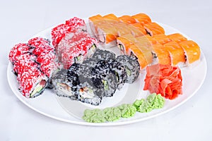 Japanese seafood Sushi roll isolated on white close up. Japanese food restaurant, sushi maki gunkan roll plate or