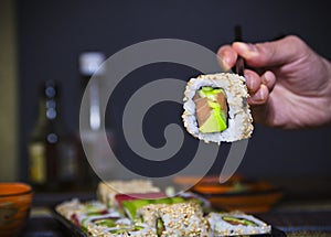 Japanese seafood sushi, rolls with tuna, salmon, avocado. California roll.