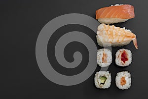 Japanese seafood sushi set on black background isolated, copy space