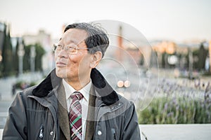 Japanese senior old man outdoors smiling and happy portrait