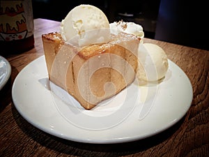 Japanese Shibuya honey toast with vanilla ice cream on served in white round plate