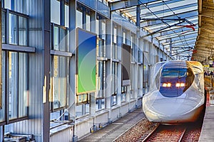 Japanese Shinkansen Speedy Bullet train At platform in Tokyo in Japan