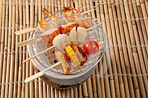 Japanese skewered seafoods vegetables photo