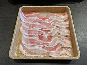 Japanese sliced pork on dish for shabu shabu sukiyaki