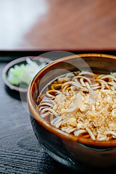 Japanese soba noodle in ceramic bowl with tempura